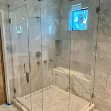 Custom Corner Shower Enclosure Featuring Curved Glass in Austin, Tx 0